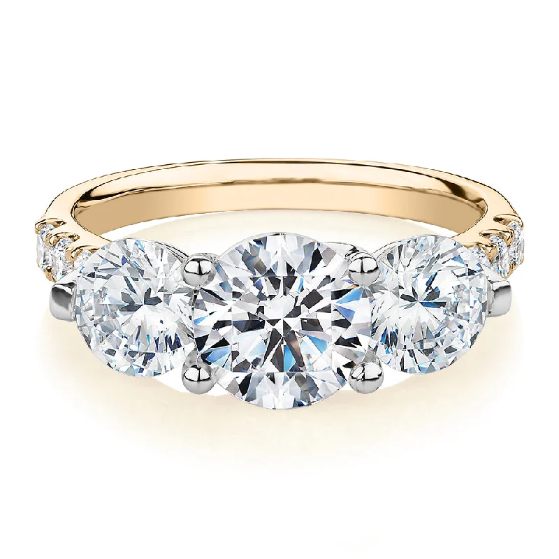 Trending Jewelry Now At Unbeatable Prices Three stone ring with 3.59 carats* of diamond simulants in 10 carat yellow and white gold